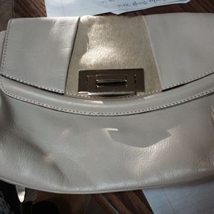 Cream colored italian leather tre vero purse.
